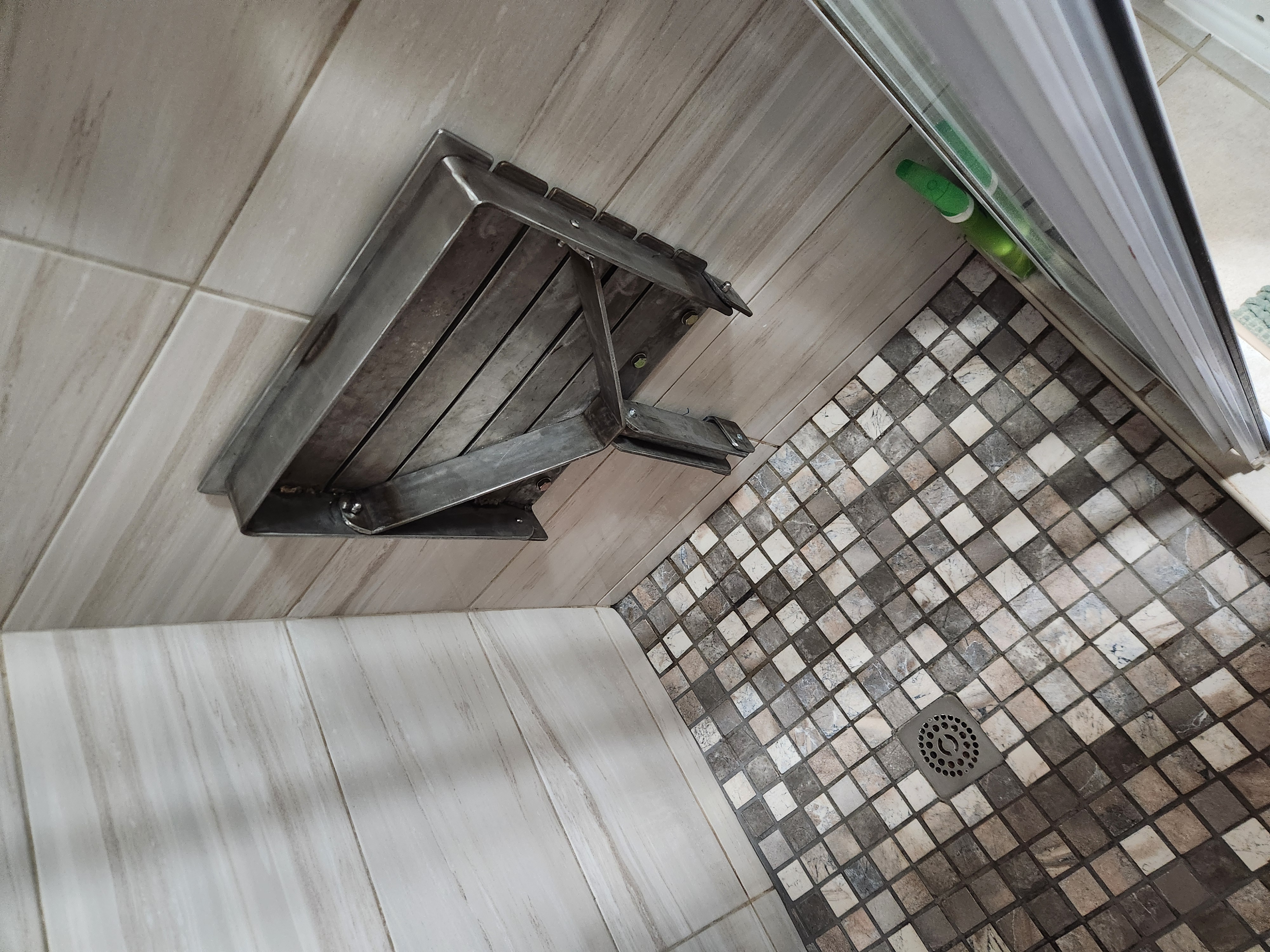 Fold-out shower seat
